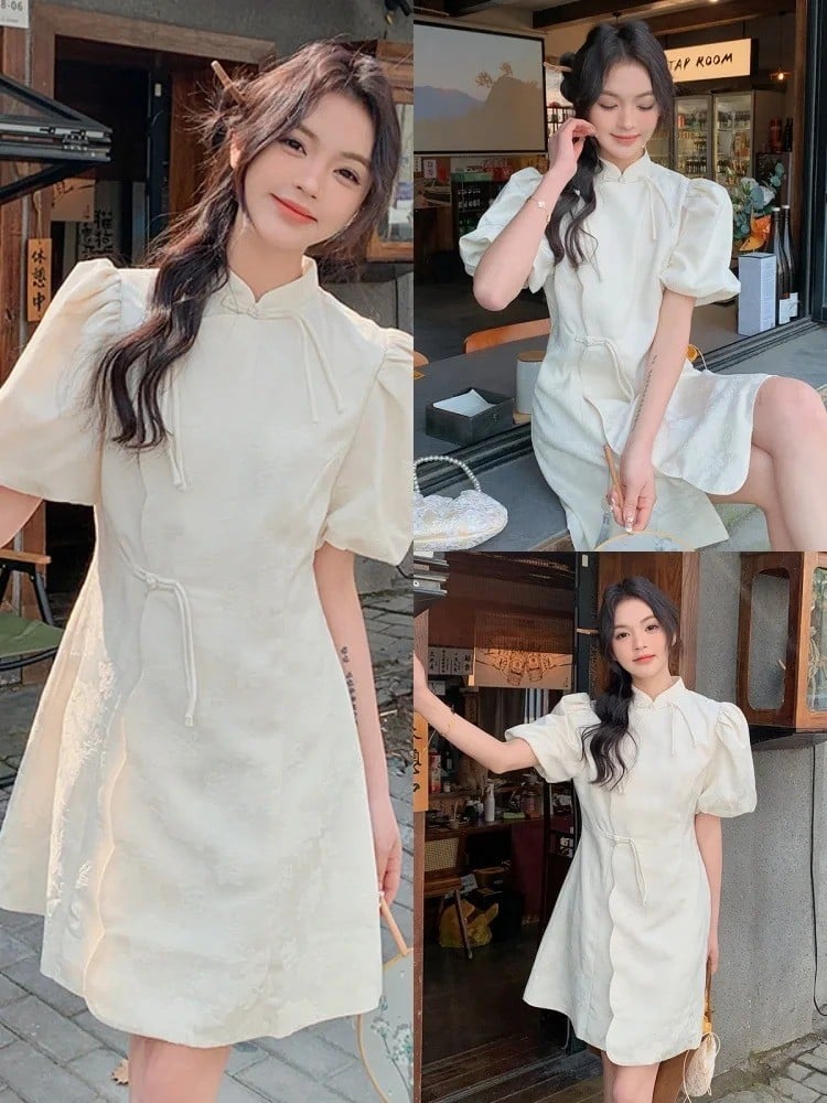 Sườn xám màu trắng tay lỡ vai bồng