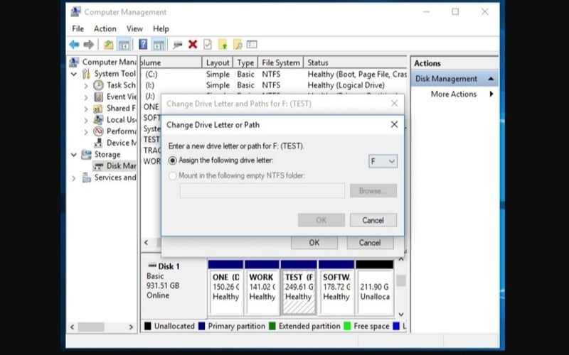 Chọn vào ô Assign the following drive letter