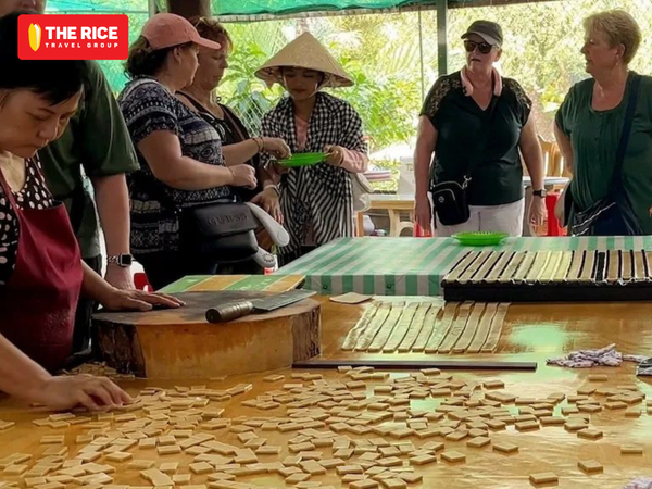 Visitors can witness firsthand the process of making Ben Tre coconut candy.