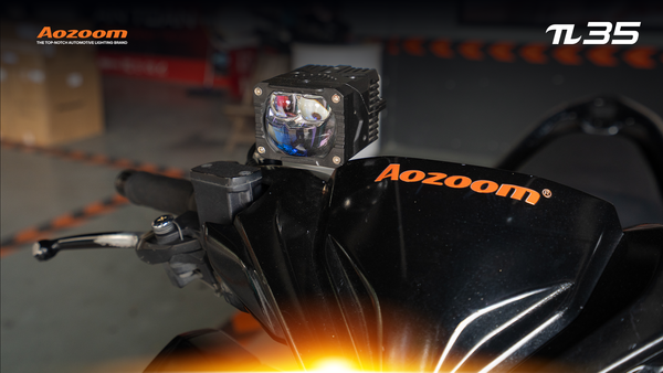 The AOZOOM π35 spotlight is neatly installed in the mirror position of a Honda Vario