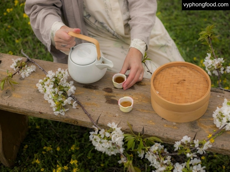 A warm cup of South African rooibos tea styled with heritage tea-gathering elements, highlighting caffeine-free, antioxidant benefits and African Dawn teabags for modern wellness and better sleep.