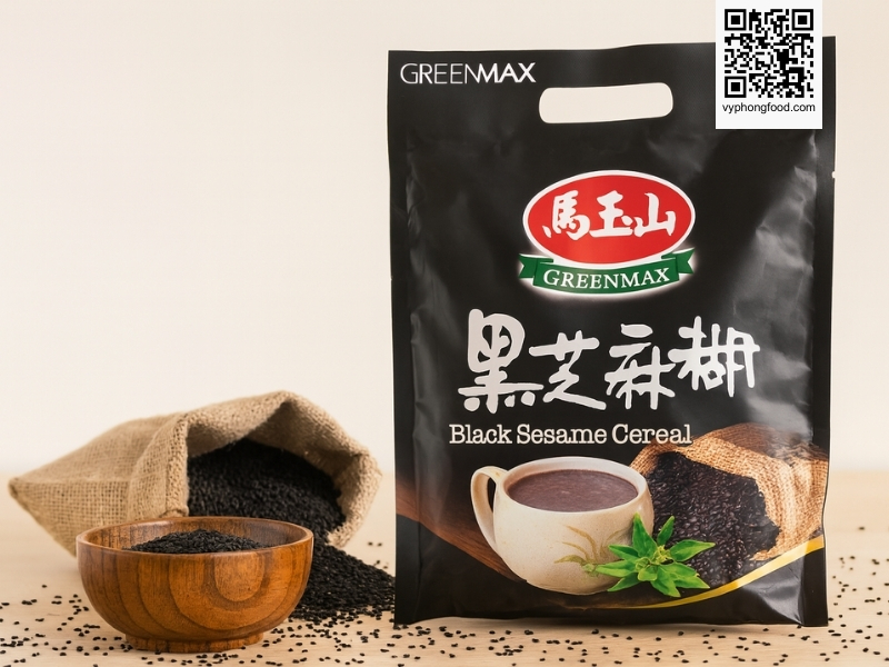 Black sesame and mixed grains cereal Greenmax Taiwan sachets on a table with natural grains around them, showing a convenient nutritious multigrain drink for modern healthy meals and weight management.