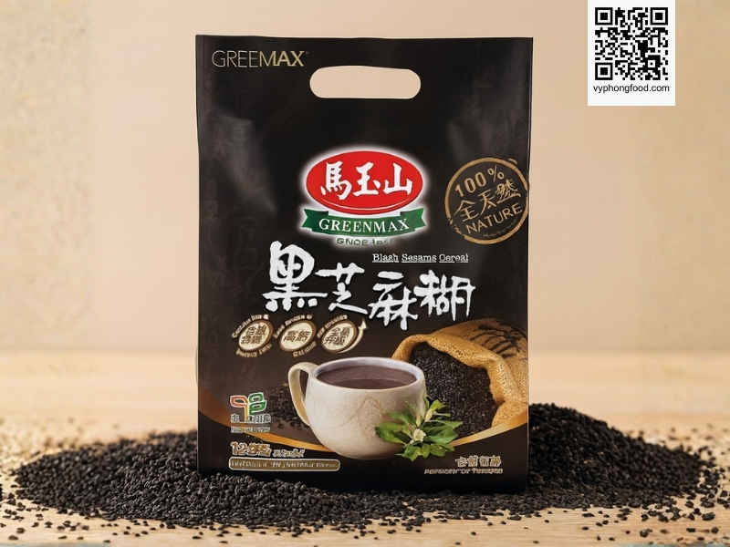 Black sesame and mixed grains cereal Greenmax Taiwan sachets on a table with natural grains around them, showing a convenient nutritious multigrain drink for modern healthy meals and weight management.