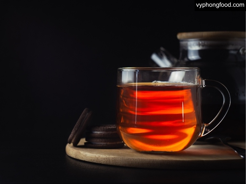 Cup of South African Rooibos Tea on a bedside table, illustrating a caffeine-free bedtime routine with science-based nutrition tips and a 7-day plan to improve sleep quality.