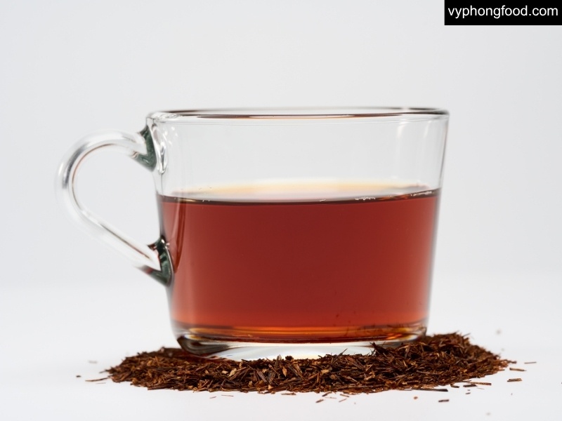 Styled scene in the Pantone Rooibos shade with South African Rooibos Tea teabags, highlighting a caffeine-free, antioxidant-rich herbal tea lifestyle for better sleep by African Dawn via vyphongfood.com.