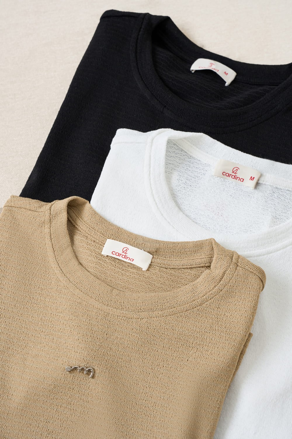 Áo thun xốp tay cộc cổ tròn đính tag ngực cao cấp