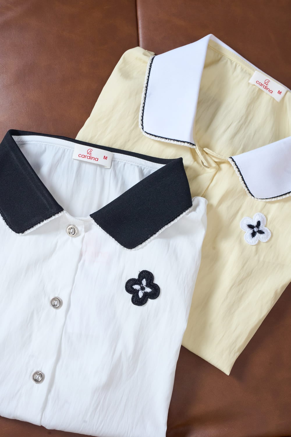 Áo sơ mi vải thô gió tay cộc gấu rút phối cổ