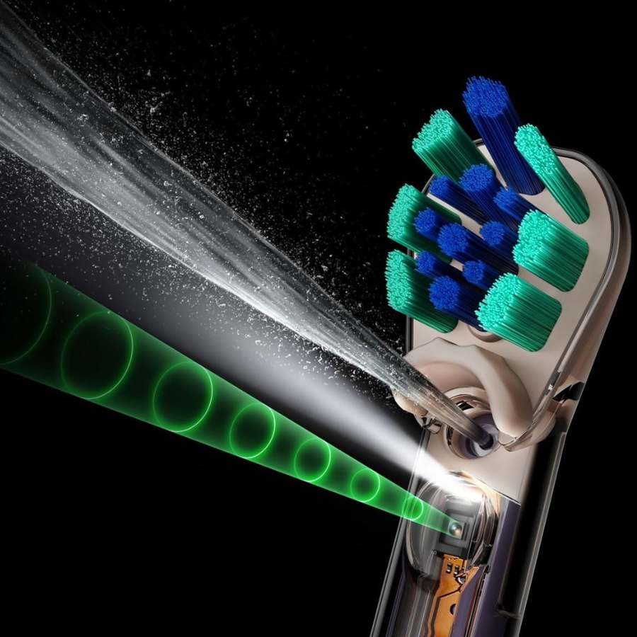 Đầu bàn chải kép của Dyson CameraJet™ được tạo hình phù hợp với đường viền răng và nướu