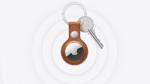 AirTag on leather keychain with keys.