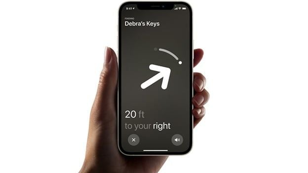 iPhone screen displaying AirTag Precision Finding interface with directional arrow and text ‘20 ft to your right’ for locating ‘Debra’s Keys