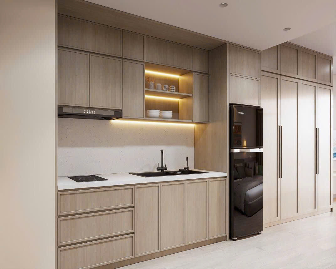 Không gian phòng khách liền bếp hiện đại trong căn hộ Studio The Onsen với gam màu trung tính.