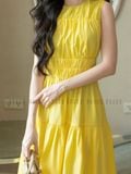 Đầm vàng nhún eo