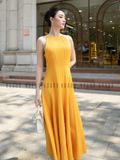 Đầm vàng cổ yếm