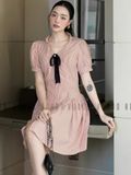 Đầm sọc cam đính nơ