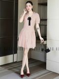 Đầm sọc cam đính nơ