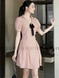 Đầm sọc cam đính nơ