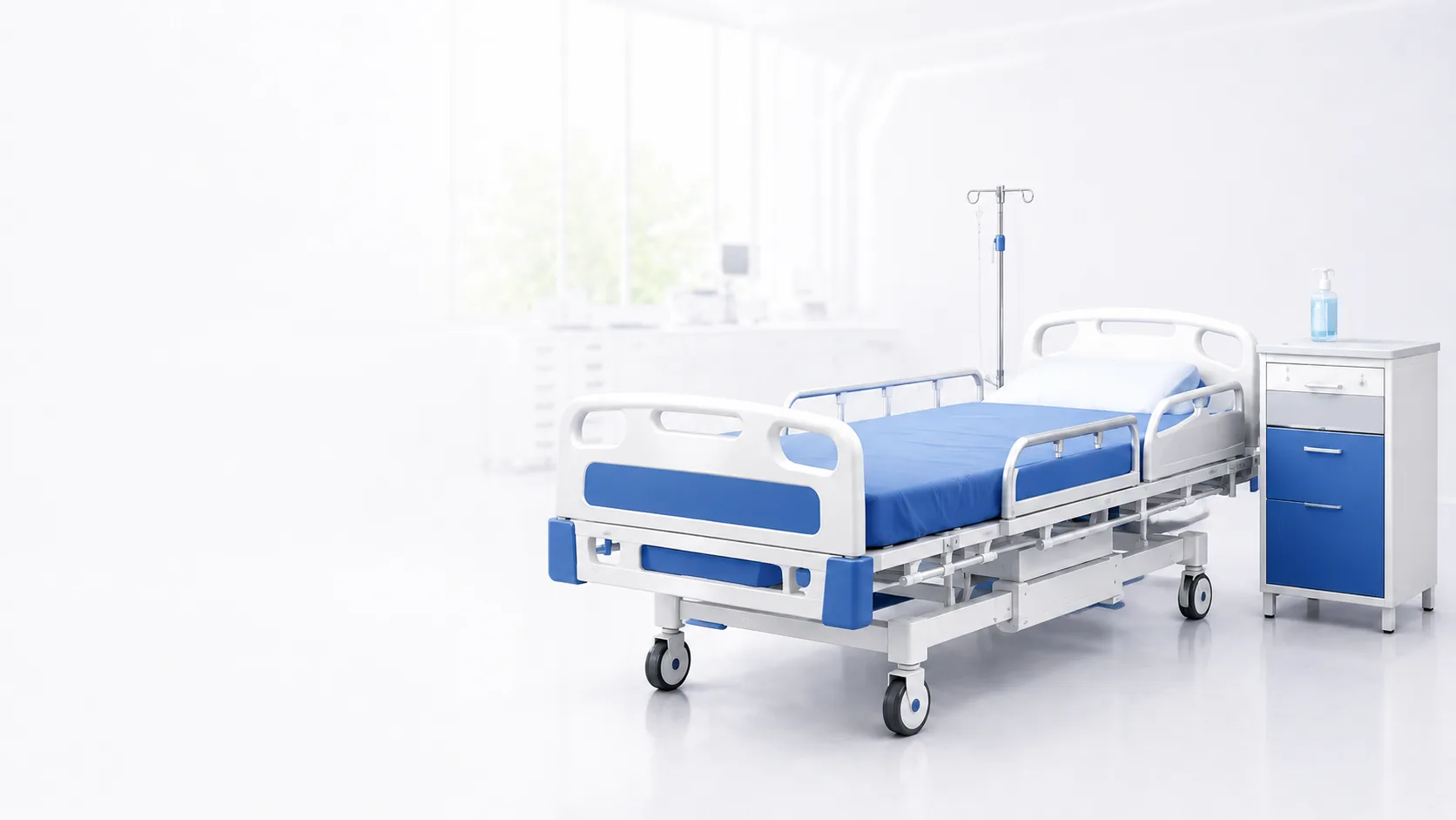 Giường bệnh và tủ đầu giường trong không gian phòng bệnh