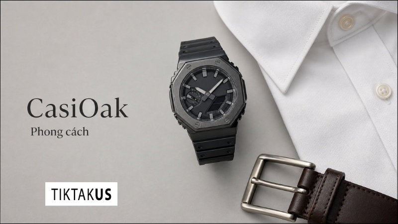 Flatlay đồng hồ G-Shock GA-2100 đặt cạnh áo sơ mi Oxford và thắt lưng da