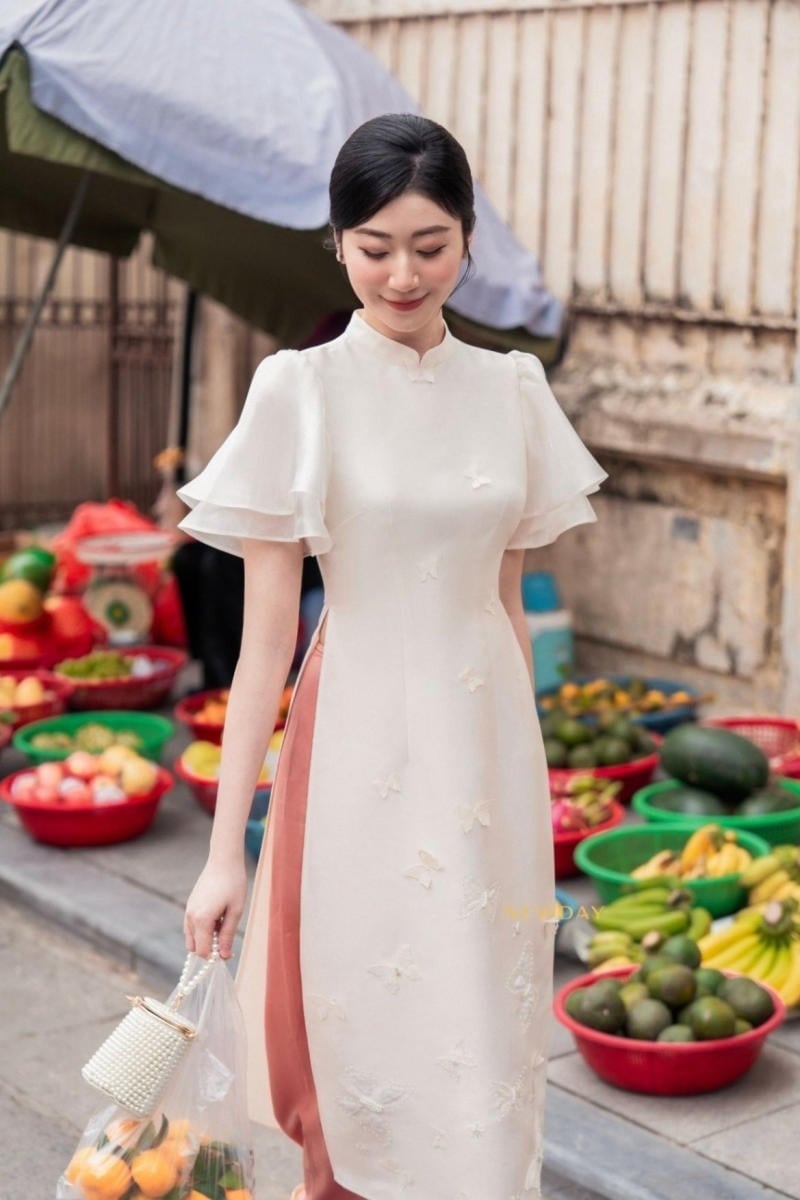 Áo dài tay phồng cánh tiên màu trắng kem đính bướm