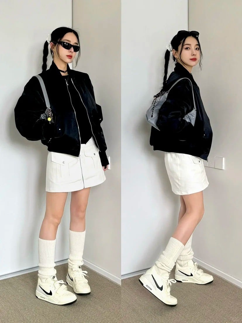 3. Áo bomber đen + Chân váy trắng + Tất ống chân + Giày Nike cổ cao trắng