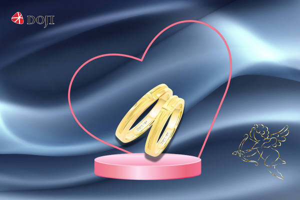 Nhẫn cưới 18K DOJI AWMG111386D1KK1 - AWFG111386D1KK1 nổi bật với họa tiết chữ 
