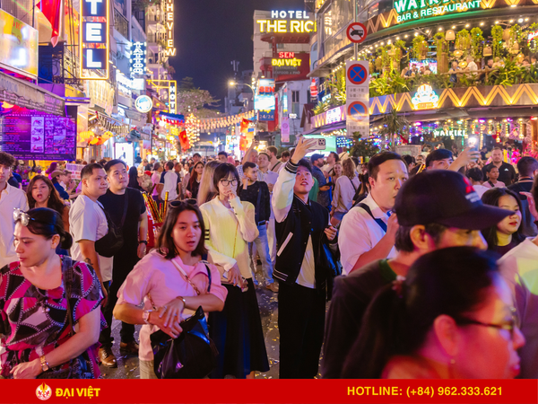The vibrant atmosphere of Bui Vien Walking Street at night.