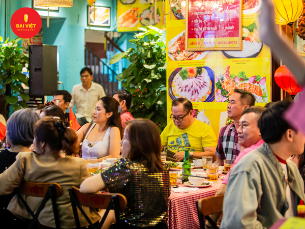 The restaurant features an open-plan design, allowing diners to enjoy their meal while watching the bustling street below.