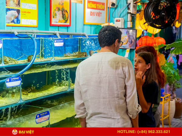 Upon entering the restaurant, guests will see a large, modern seafood tank with a variety of shrimp, crab, and fish