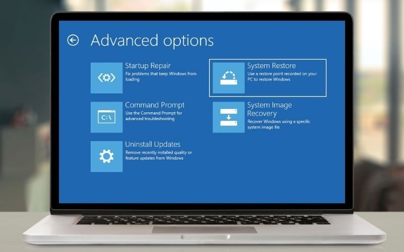 Tại màn hình xanh, chọn&nbsp;Troubleshoot&nbsp;>&nbsp;Advanced options&nbsp;>&nbsp;System Restore