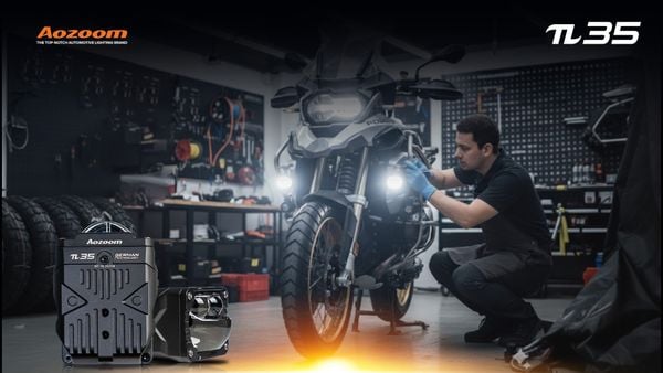 An AOZOOM π35 auxiliary light mounted low on a motorcycle for superior visibility in fog and rain.