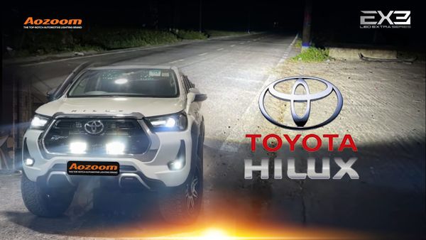Toyota Hilux with an AOZOOM EXTRA 3 light bar for off-roading.