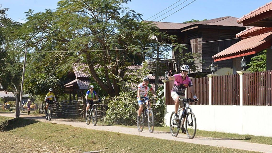 CYCLING THROUGH VILLAGES ALONG THE MEKONG IN LAOS