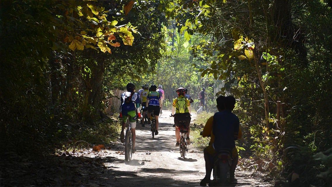CYCLING THROUGH VILLAGES ALONG THE MEKONG IN LAOS