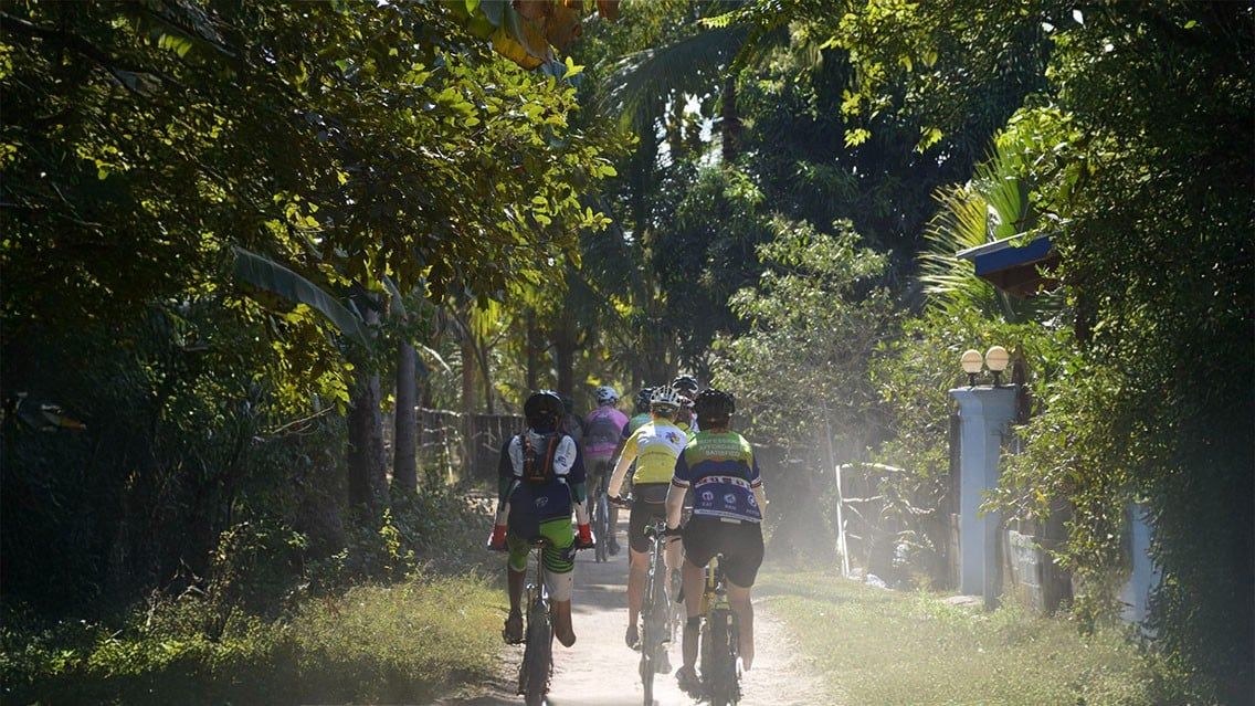 CYCLING THROUGH VILLAGES ALONG THE MEKONG IN LAOS