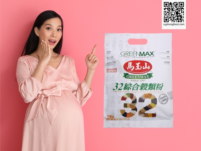 young vietnamese pregnant woman in her first trimester sitting indoors and reading online articles about whether it is safe to drink greenmax multigrain cereal as a healthy prenatal nutritional cereal powder, supporting product introduction and brand awareness for greenmax from vyphongfood.com.