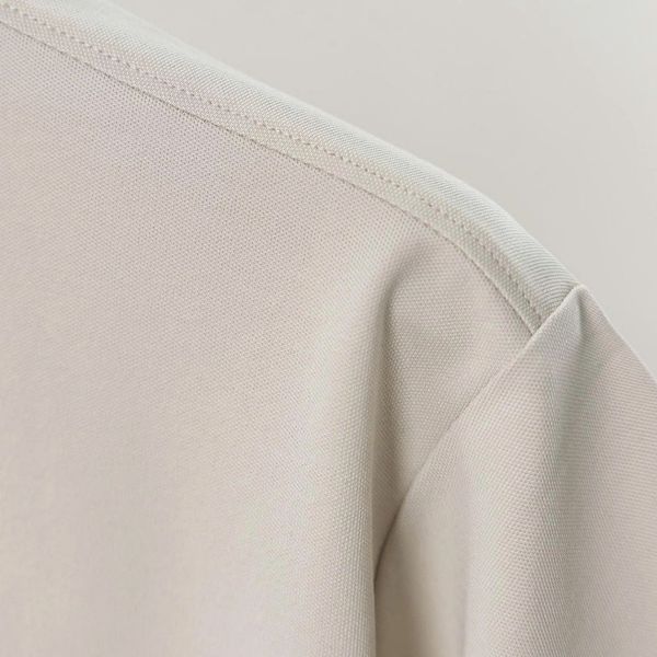 Chi tiết áo polo kem big size nam AKYOO