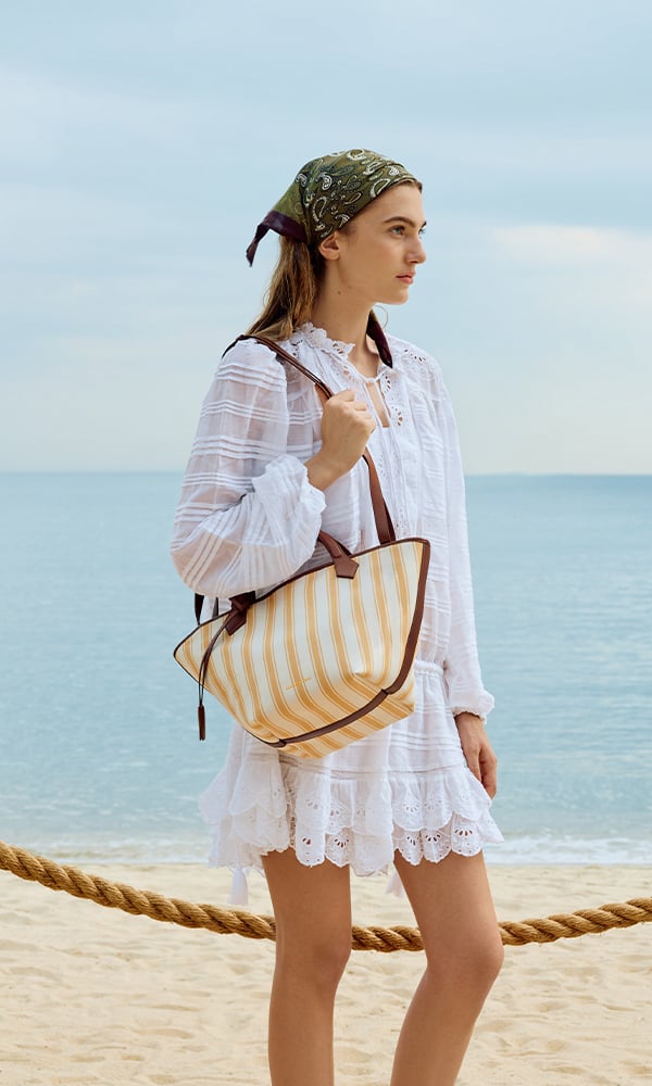 Bubblegum pink Sammie Knotted-Handle Elongated Bag; Sea Salt Blue Sammie Knotted-Handle Front-Flap Bag and Butter Yellow Crochet Flower Beaded Charm - CHARLES & KEITH