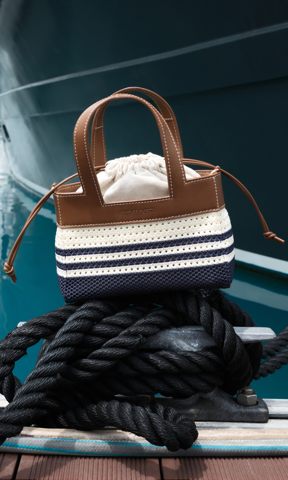 Bubblegum pink Sammie Knotted-Handle Elongated Bag; Sea Salt Blue Sammie Knotted-Handle Front-Flap Bag and Butter Yellow Crochet Flower Beaded Charm - CHARLES & KEITH