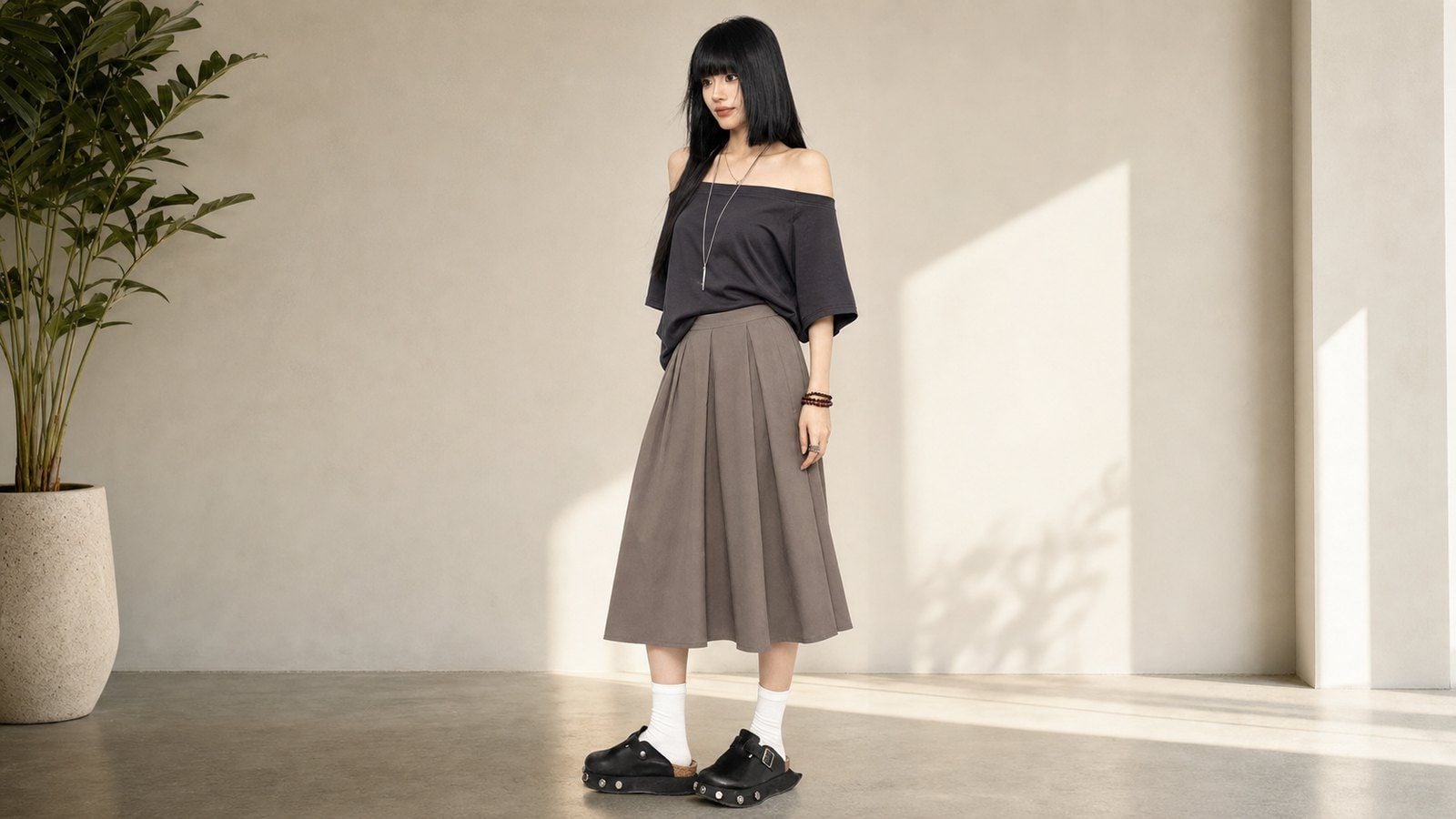 Áo trễ vai phối chân váy midi để set đồ mềm hơn nhưng vẫn thanh