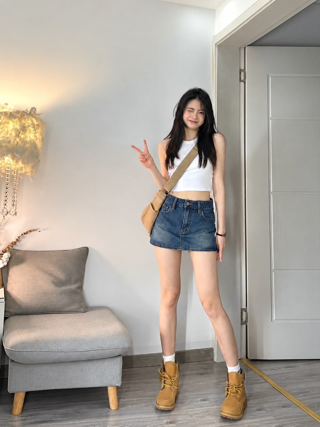 Chân váy jean ngắn phối boots cổ thấp màu nâu