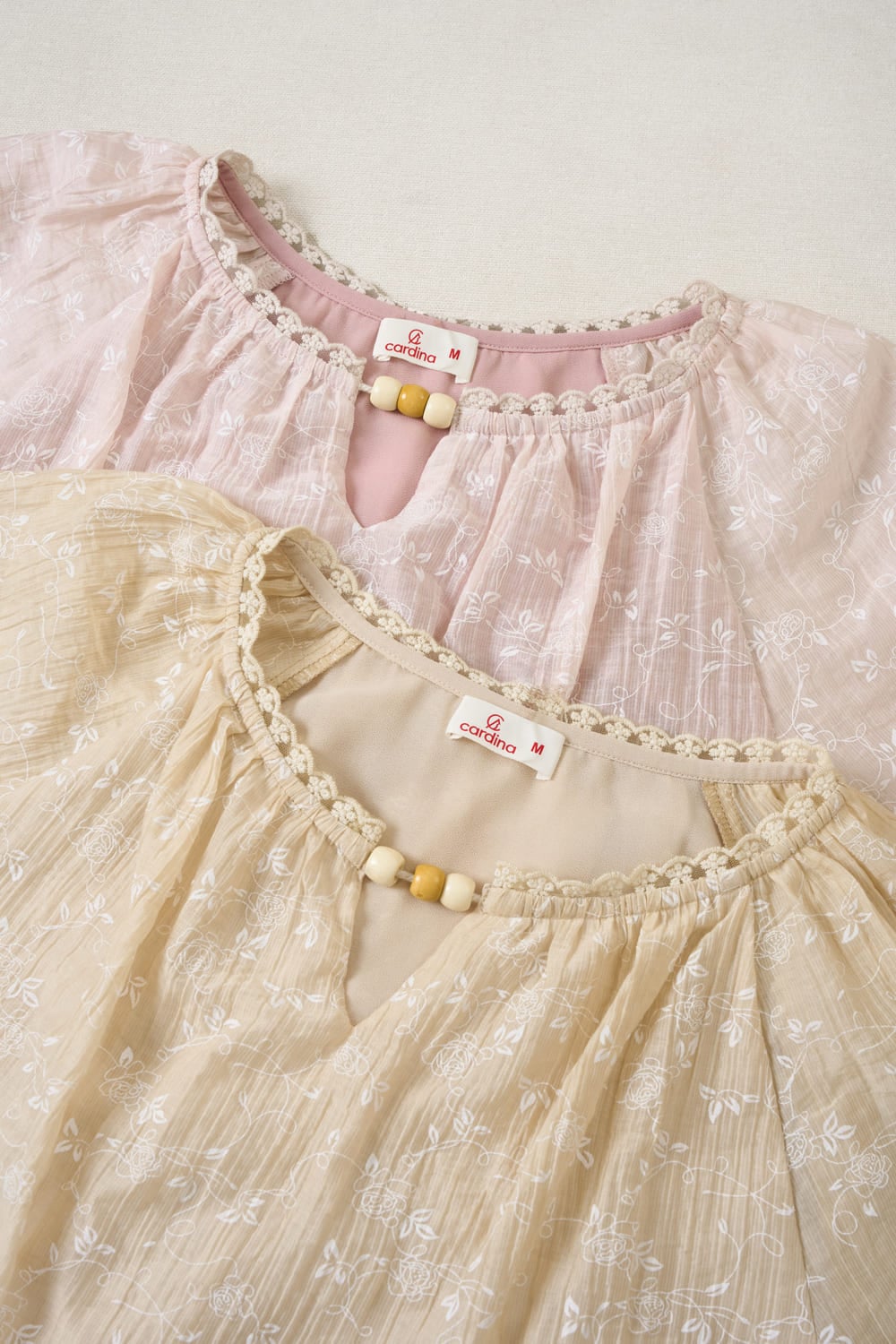 Áo thô nữ thêu tay cộc Raglan cổ tròn phối viền