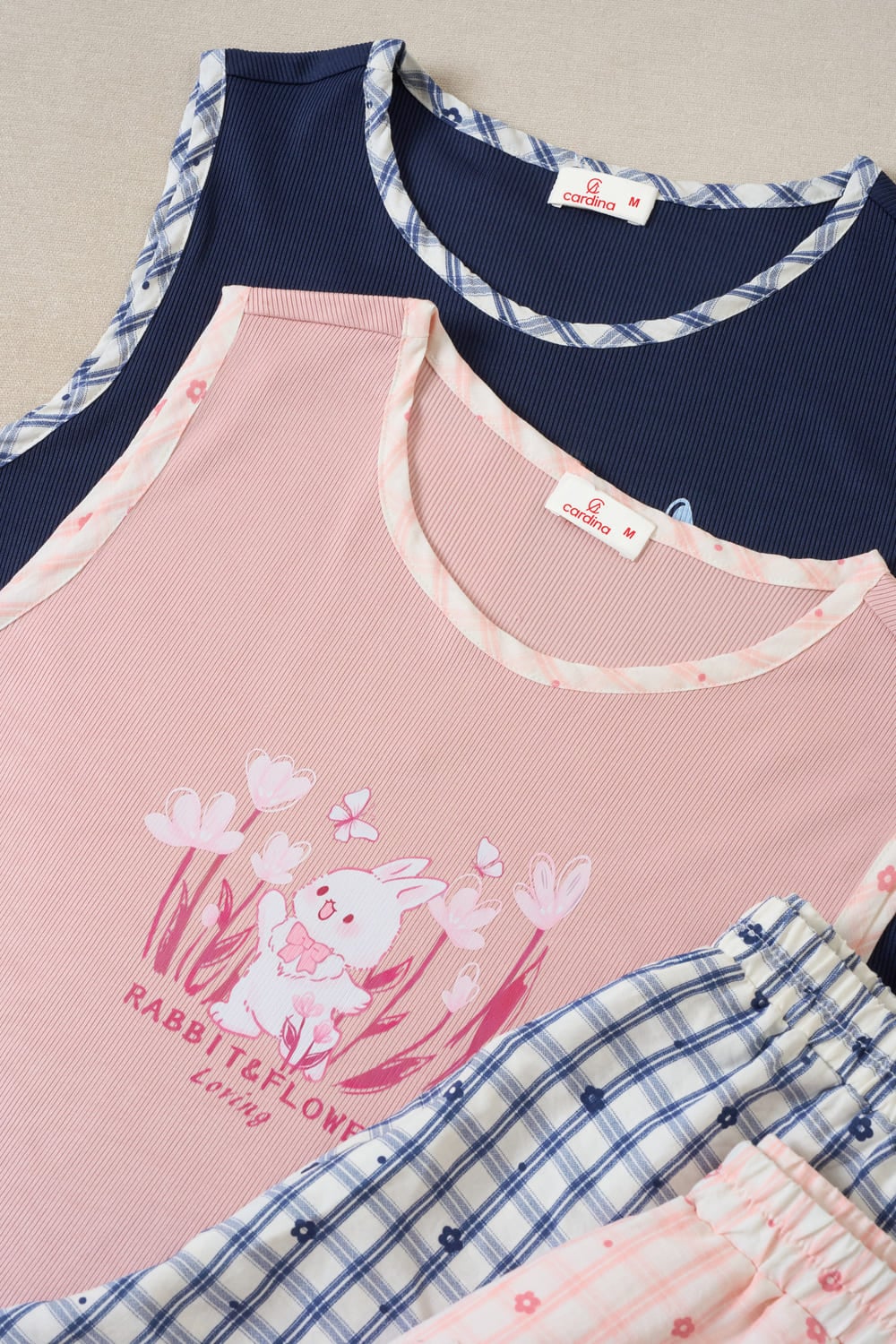 Bộ đồ nữ vải Tăm lạnh sát nách cổ tròn phối quần thô kẻ