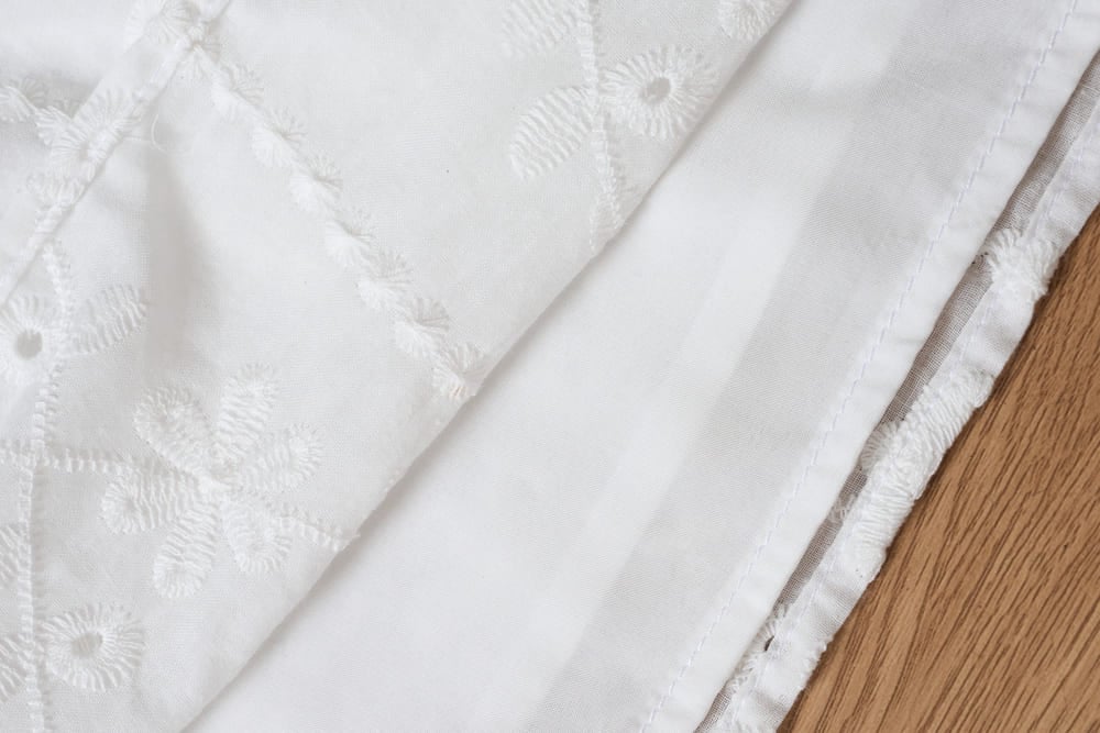 Áo thô nữ thêu tay cộc Raglan cổ tròn phối viền