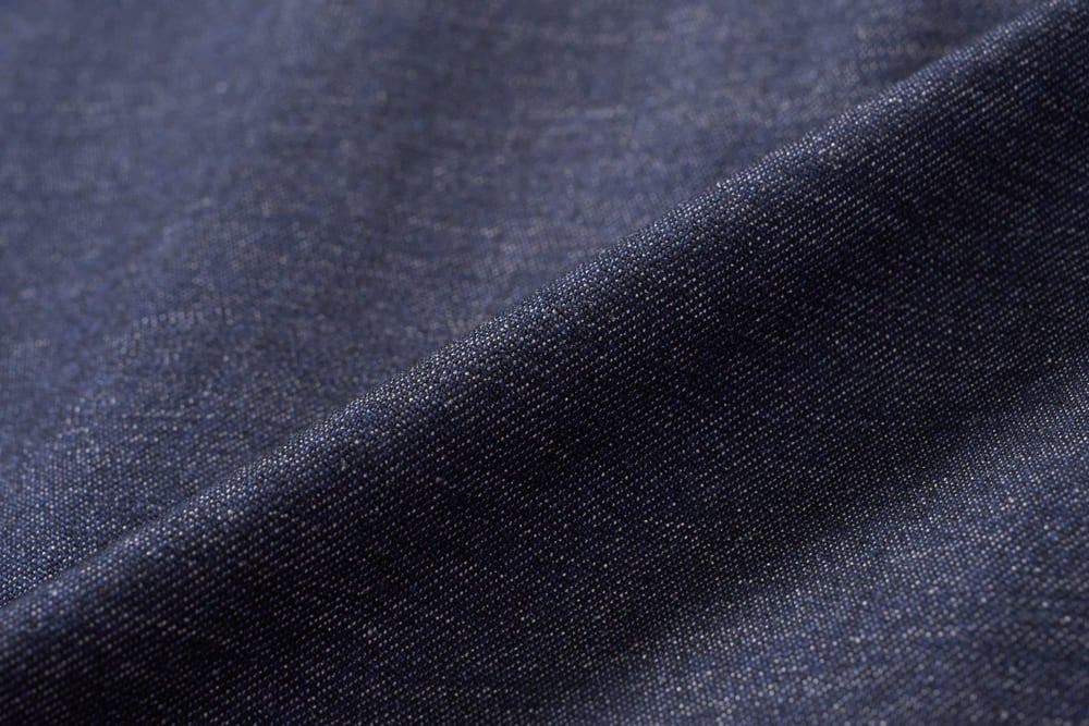 Chân váy denim xòe xếp ly hai bên