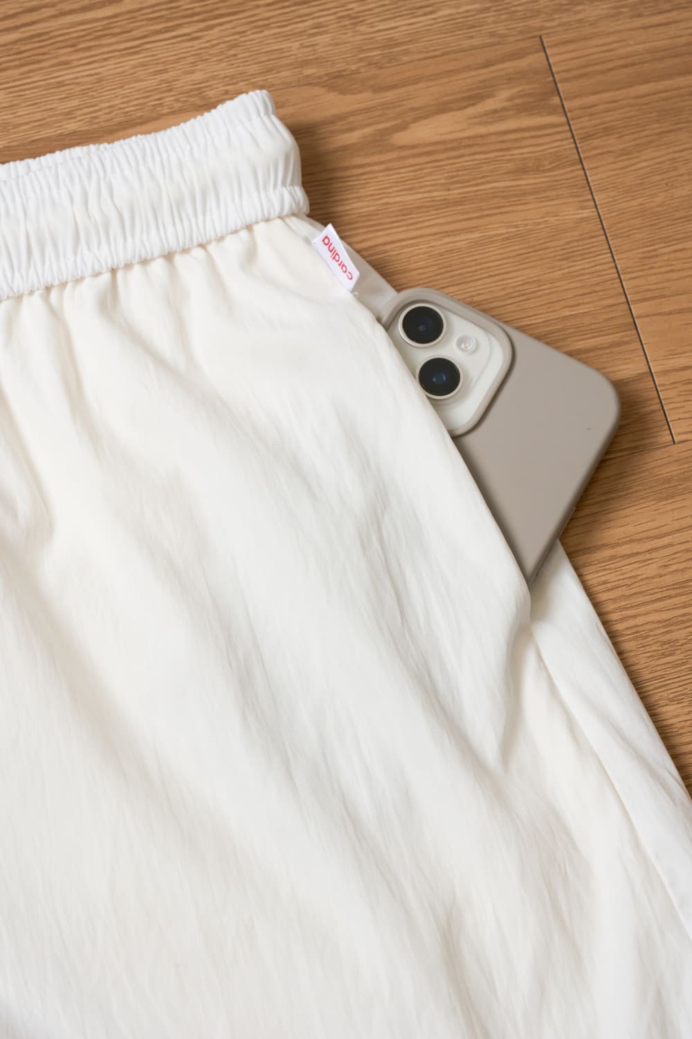 Quần sooc nữ thô gió dáng A cạp chun phối gấu