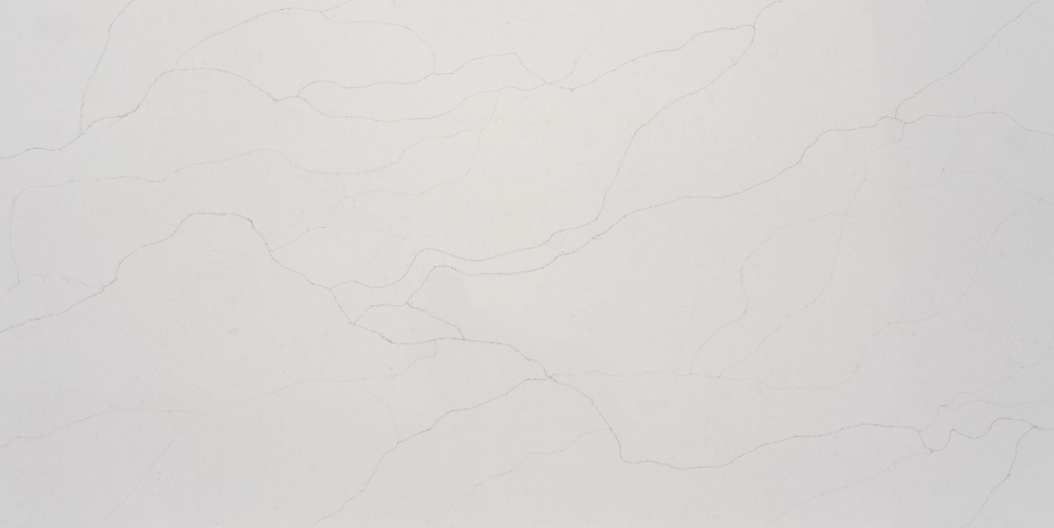 Calacatta Marfil Gold features a warm white background with soft, organic gold veining that brings subtle luxury and a naturally elegant look to any interior surface.
