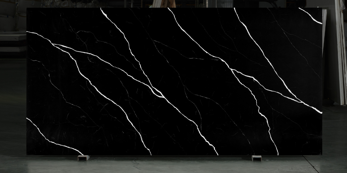 Calacatta Black Maracaibo features a deep black background cut through by bold white diagonal veins and fine intersecting lines, creating a dramatic high contrast look ideal for statement countertops, islands and feature walls.  Overview