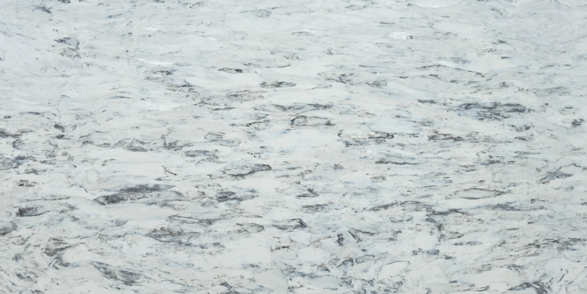 Calacatta Kinoss features a bright white background with layered grey veining and mineral-like cloudy patterns that spread organically across the surface.