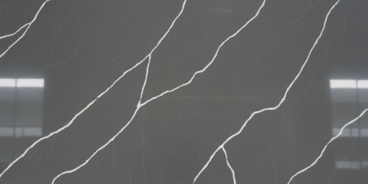 Calacatta Nero features a deep charcoal-grey background accented by long, sharp white veining that creates a bold high-contrast marble look.