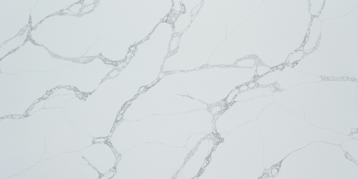 Calacatta Odyssey features a crisp white background accented by distinctive grey web-veins that move naturally across the surface.